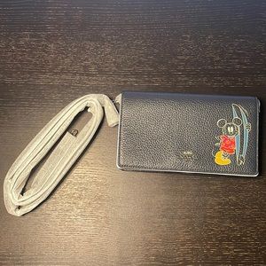 This is a Japan exclusive Coach X Disney collaboration cross body wallet. New.